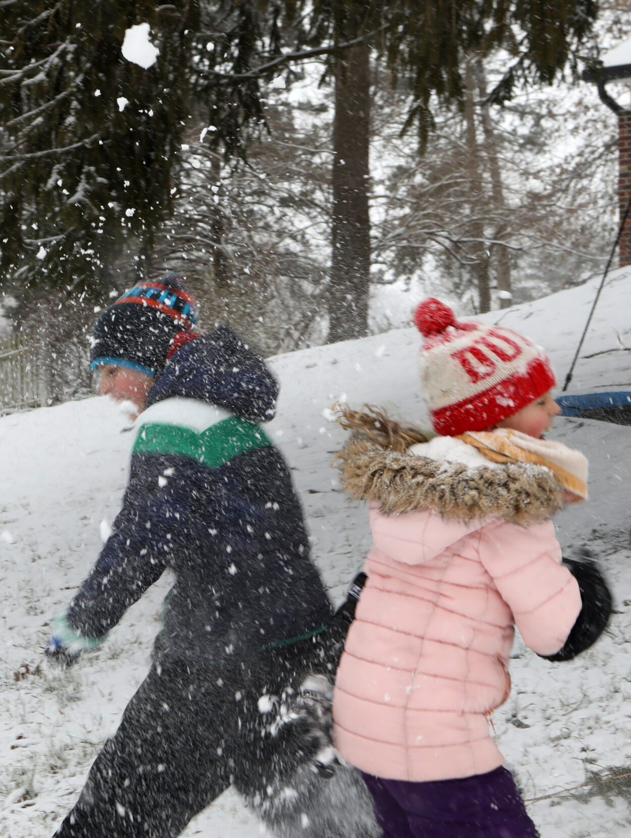 Henry Nothum throws a snowball at Millie